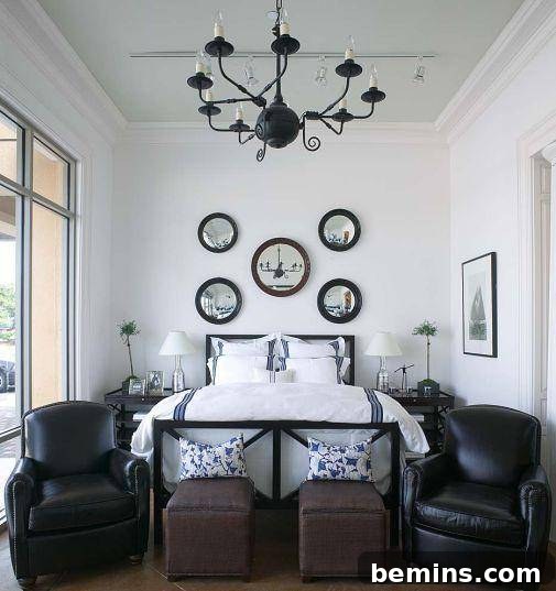 A minimalist bedroom featuring an iron bed with clean, linear designs.