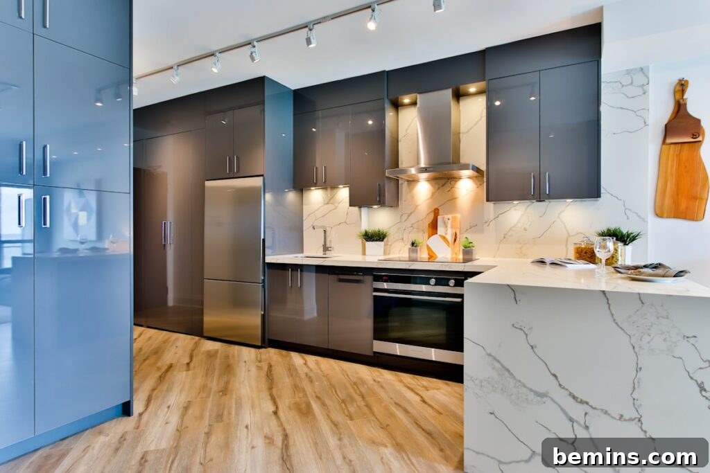 Modern kitchen with white and black countertops and stylish flooring.