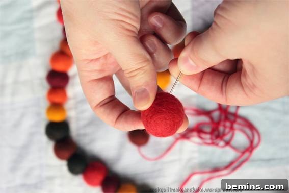 A colorful and textured felted ball garland.