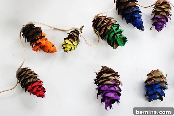 A colorful and whimsical rainbow dipped pine cone garland.