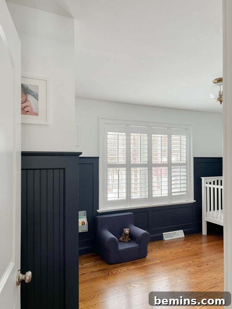 Baby's room with nautical blue wainscoting. 