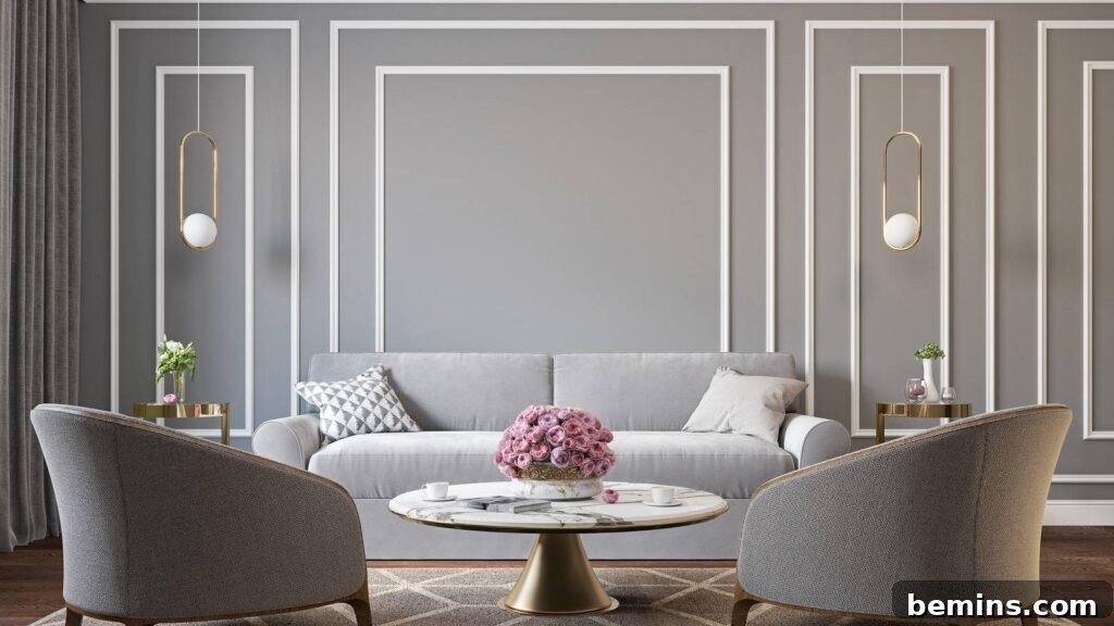 Gray with white trim wainscoting behind gray couch and gold accent table