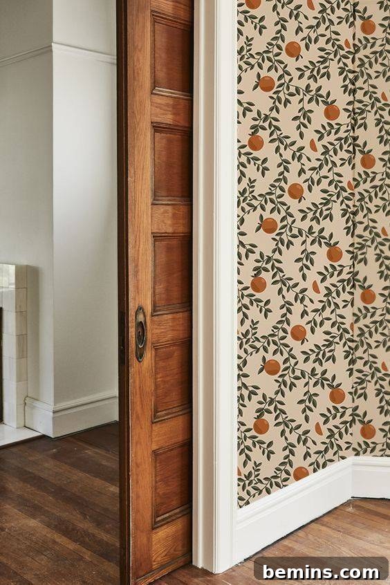 Budget Bedroom Wallpaper: Stylish Upgrades That Won't Break the Bank 13 Vintage removable wallpaper with oranges and green leaves adding a unique touch