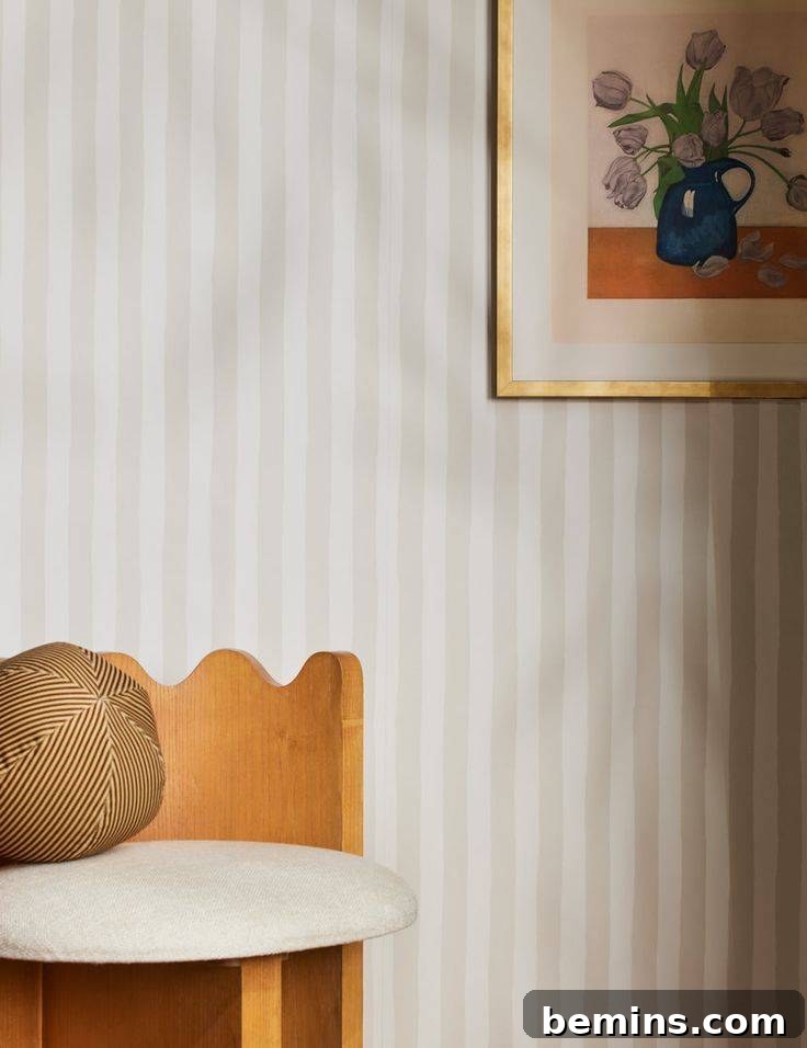 Budget Bedroom Wallpaper: Stylish Upgrades That Won't Break the Bank 16 Cream and white striped wallpaper adding a subtle elegance to a bedroom
