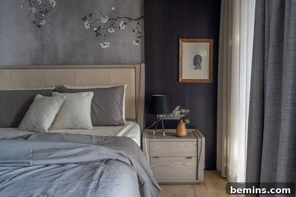 Budget Bedroom Wallpaper: Stylish Upgrades That Won't Break the Bank 21 Grey wallpaper with japanese flowers, grey comforter, and beige end table