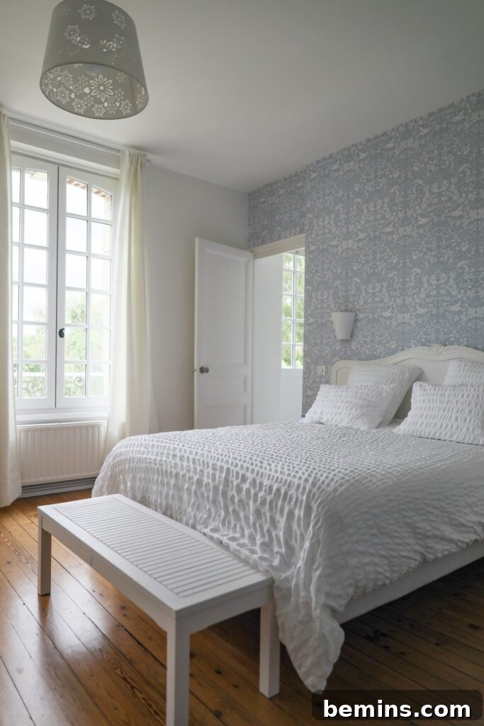 Budget Bedroom Wallpaper: Stylish Upgrades That Won't Break the Bank 9 Neutral toned bedroom showcasing a tranquil and relaxing space