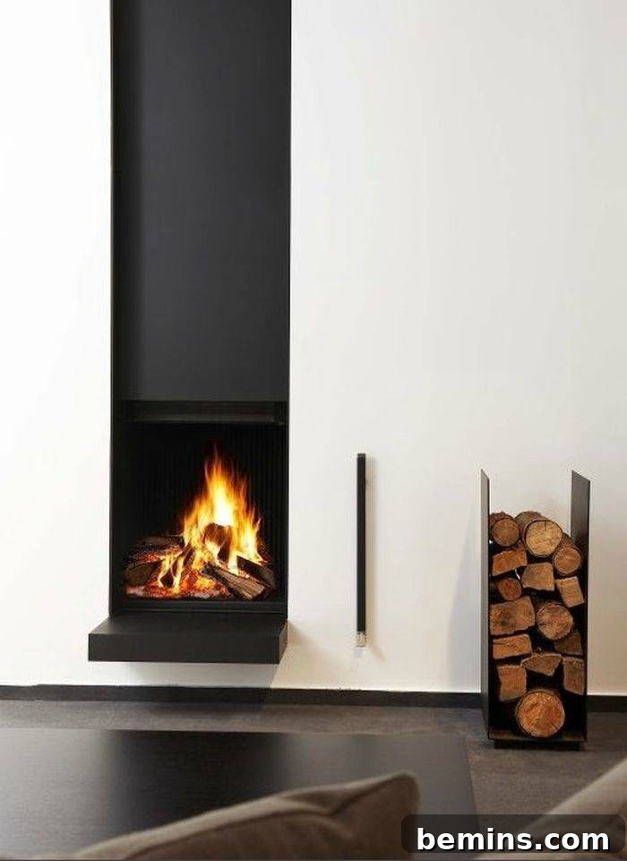 Modern floating fireplace with a metal firewood storage rack beneath it.