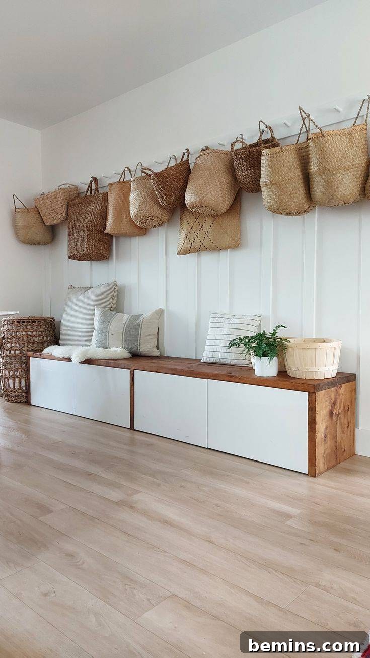 Striking IKEA BESTA Transformations for a Unique Home 3 Wooden Ikea BESTA bench with white painted doors under wicker baskets on wall.