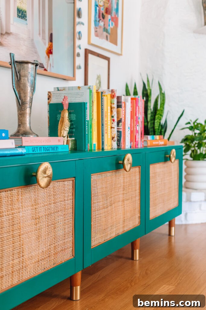 Striking IKEA BESTA Transformations for a Unique Home 4 Rattan Ikea Besta with turquoise trim and gold knobs.