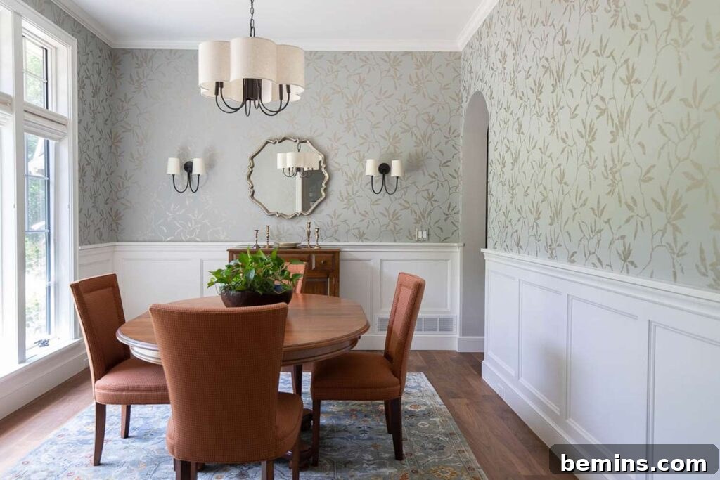 Inspiring Wainscoting: 15+ Dining Room Design Ideas 15 Dining room with white wainscoting and green and white leaves on wallpaper