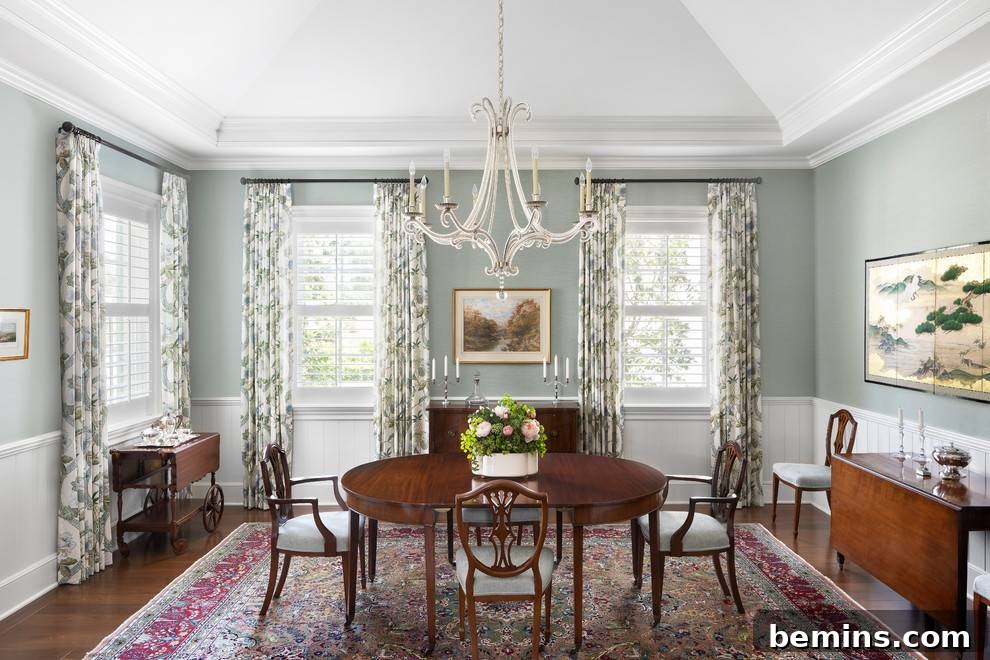 Inspiring Wainscoting: 15+ Dining Room Design Ideas 19 Dining room with white wainscoting and green and white drapes on walls around windows