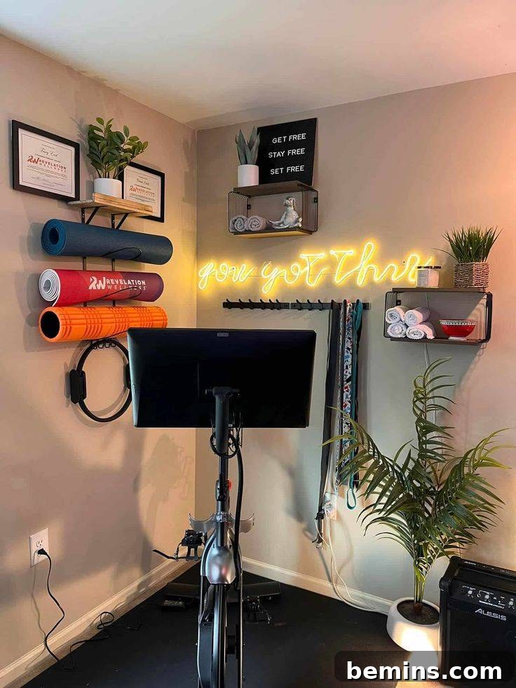 Elevate Your Workout Space: Inspiring Home Gym Designs 11 Bike with motivational quote behind it and yoga mats on wall