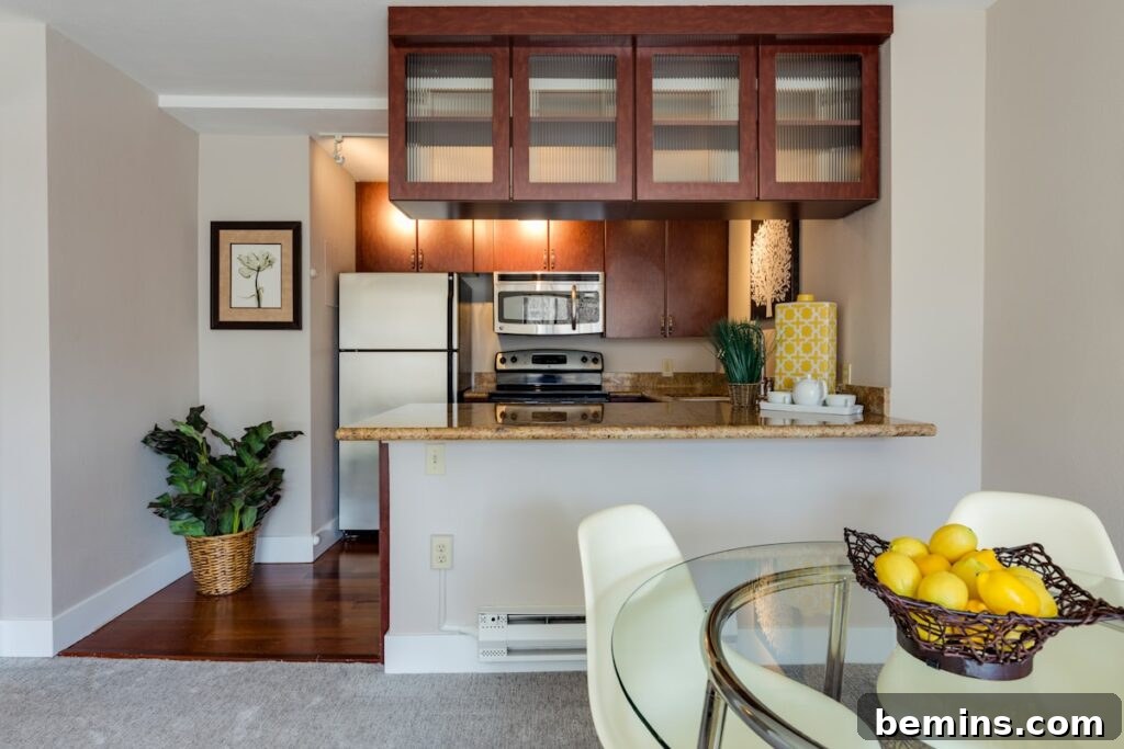 White and beige marble-top table in a stylish apartment kitchen.