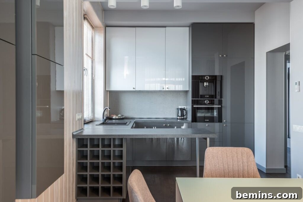 Sleek modern kitchen with neutral tones and a minimalist design, featuring efficient appliances.