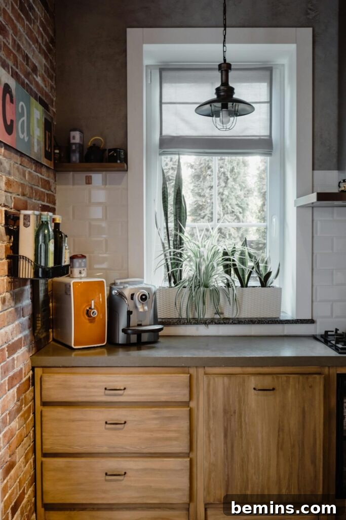 A bright kitchen space with rustic elements, featuring a coffee maker, plants, and brick accents.