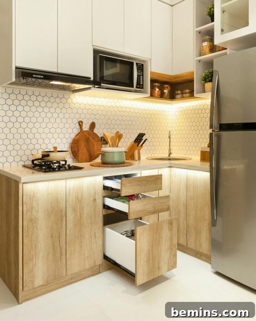 Stylish Scandinavian kitchen with wood cabinets and stainless-steel appliances.