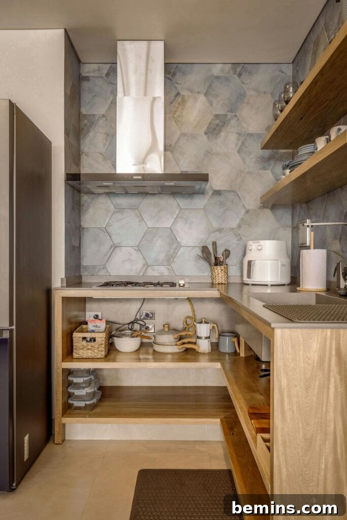 A cozy Scandinavian-style kitchen with wooden shelves and hexagonal tiles.