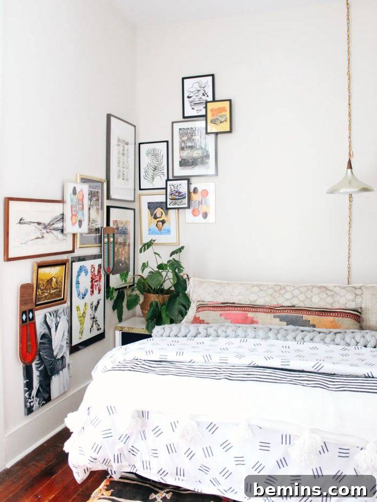 Command Strips Unleashed: Gallery Walls Without the Nail Holes 16 Layered art on wall in bedroom, using Command Strips to achieve a dynamic and customizable wall art arrangement.