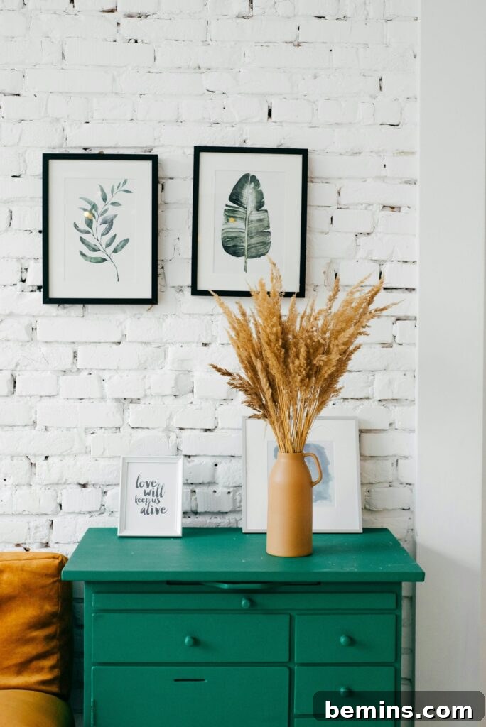 Command Strips Unleashed: Gallery Walls Without the Nail Holes 18 teal wooden drawer dresser.