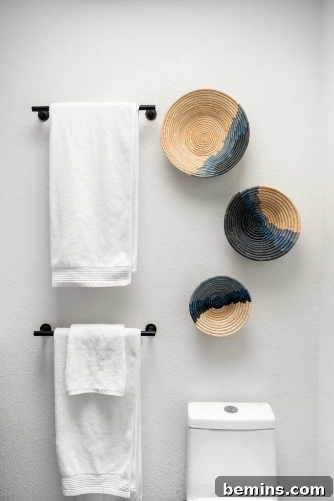 Command Strips Unleashed: Gallery Walls Without the Nail Holes 20 A pristine bathroom showcasing wall decor mounted with Command Strips, demonstrating their reliability and ease of use.