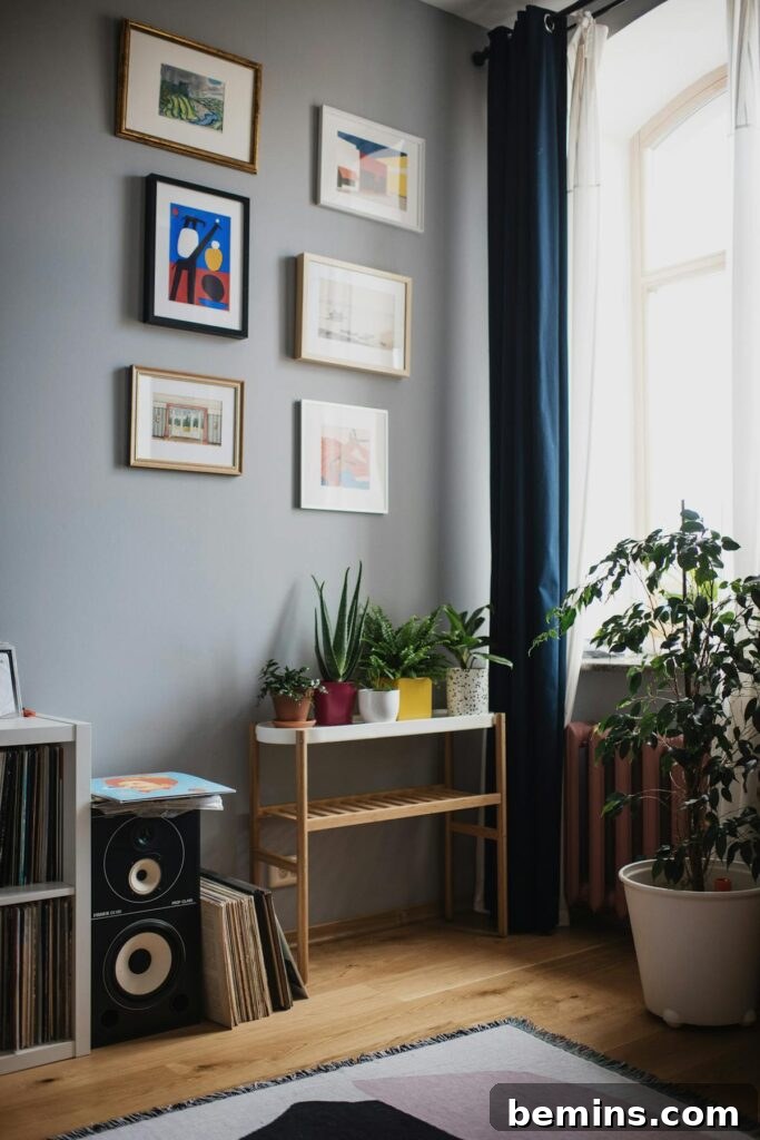 Command Strips Unleashed: Gallery Walls Without the Nail Holes 5 A stylish living room featuring indoor plants and wall art, demonstrating the seamless integration of Command Strips in home decor.