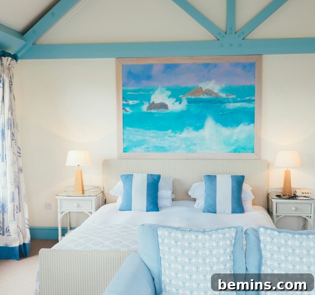 Command Strips Unleashed: Gallery Walls Without the Nail Holes 10 A bedroom with headboard art hung using Command Strips, demonstrating a damage-free and stylish bedroom decor idea.