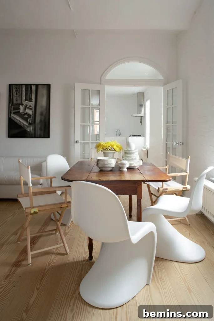 Brown dining table with white chairs