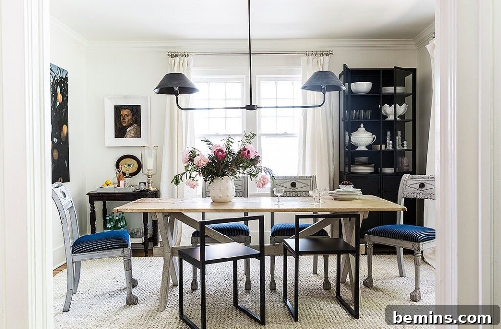 Dining table with wood top, grey vintage chairs and modern metal chairs