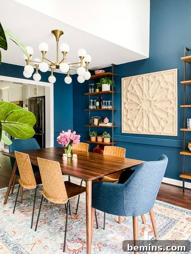 Brown wood dining table with blue upholstered chairs and brown non-upholstered chairs