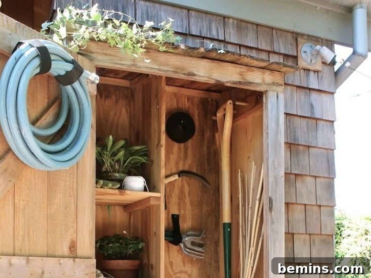 Wood garden shed with tools hanging inside