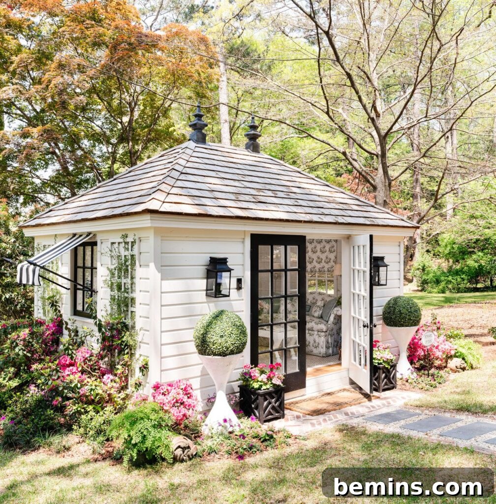 Beautiful white shed with brown doors in garden