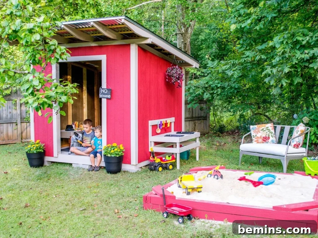 Bright red and white shed for kids in backyard