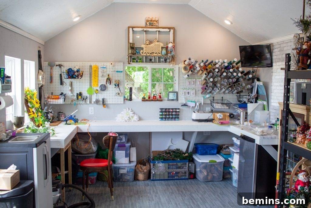 White shed interior with crafting supplies organized on large white table