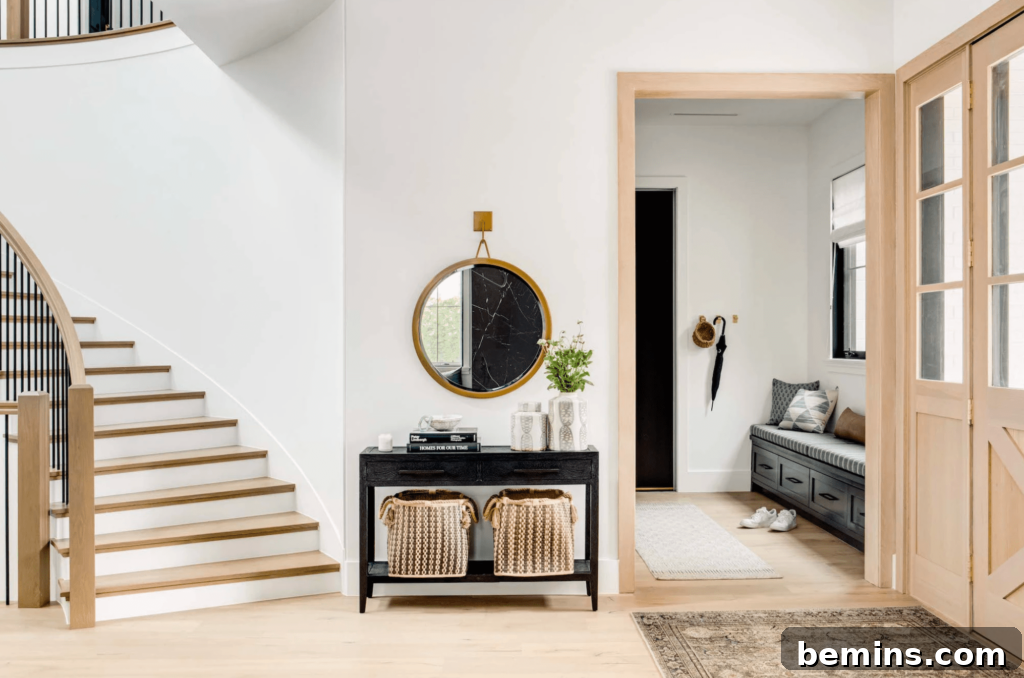 Elevate Your Entryway: Stunning Foyer Design Inspirations 12 Entryway with blue bench and brown runner leading into large foyer area