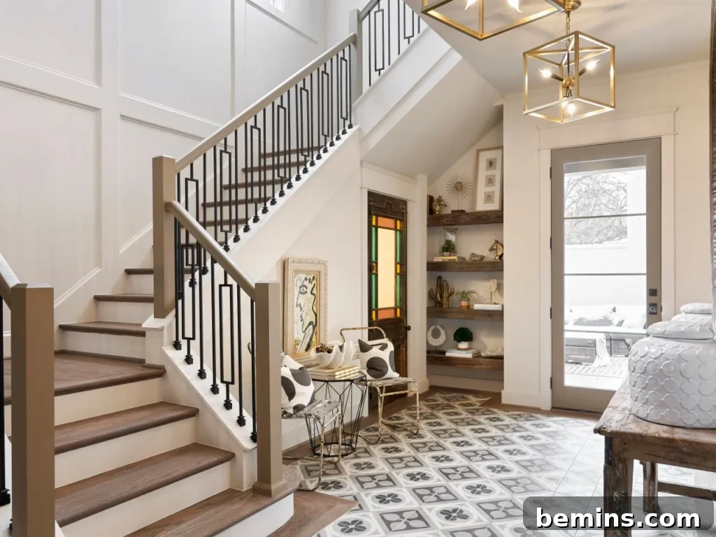 Elevate Your Entryway: Stunning Foyer Design Inspirations 15 Large stairs in cream painted foyer with old and modern decor