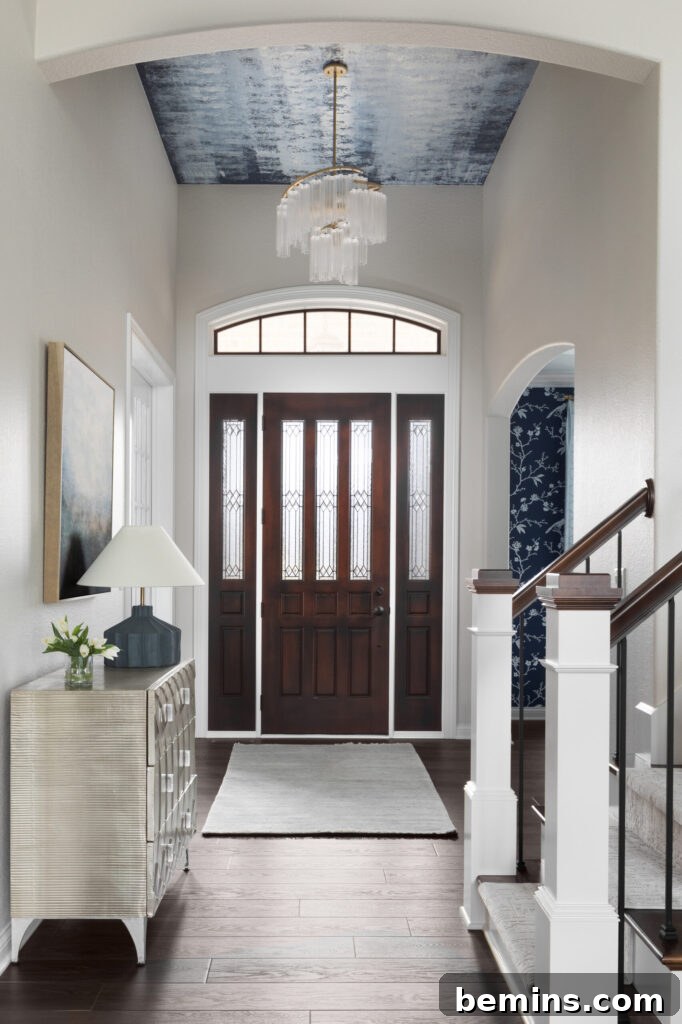 Elevate Your Entryway: Stunning Foyer Design Inspirations 16 Large foyer entry with blue painted ceiling and brown door