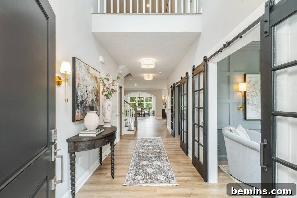 Elevate Your Entryway: Stunning Foyer Design Inspirations 17 Open door leading into a foyer with wooden side table and grey runner