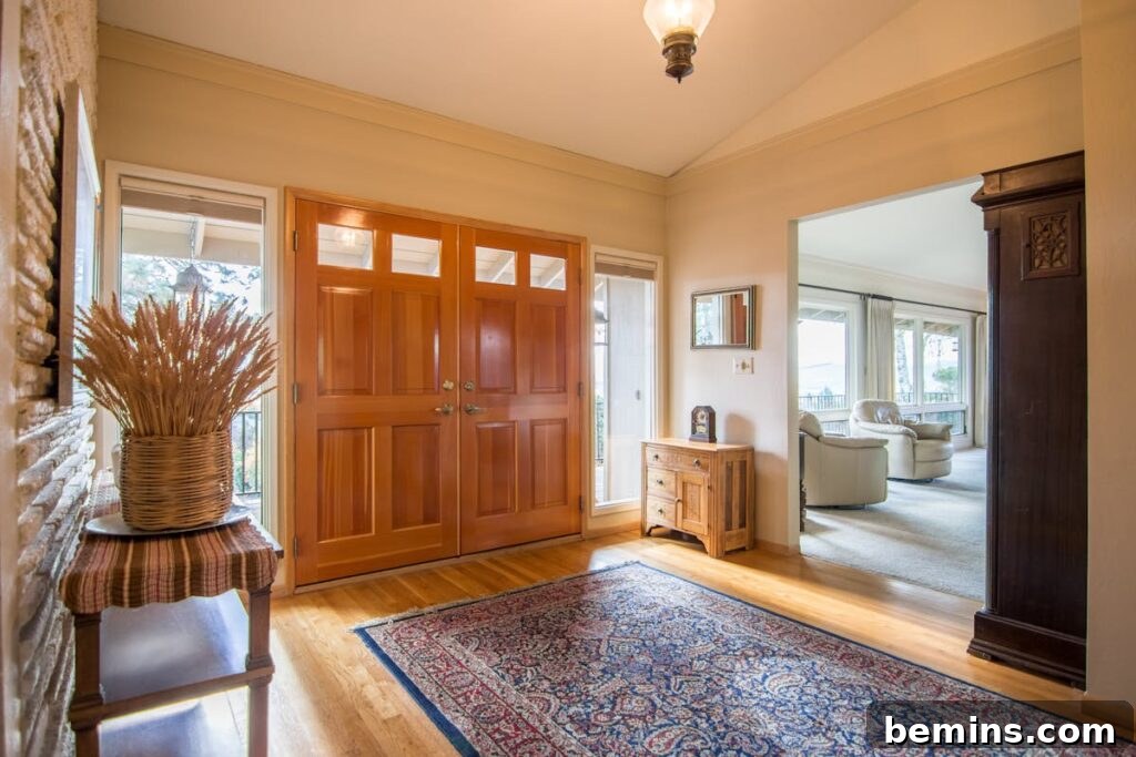 Elevate Your Entryway: Stunning Foyer Design Inspirations 10 Spacious home entrance with wooden doors and elegant interior design elements.