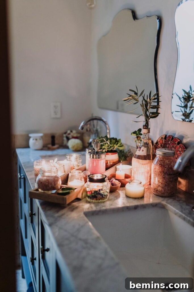 Effortless Home Oasis: Your Guide to a Summer Staycation 2 Warm bathroom countertop featuring candles and skincare products for a serene ambiance.
