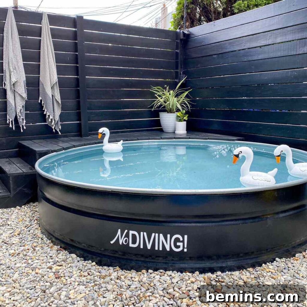 Effortless Home Oasis: Your Guide to a Summer Staycation 19 Small black pool with three inflatable swans