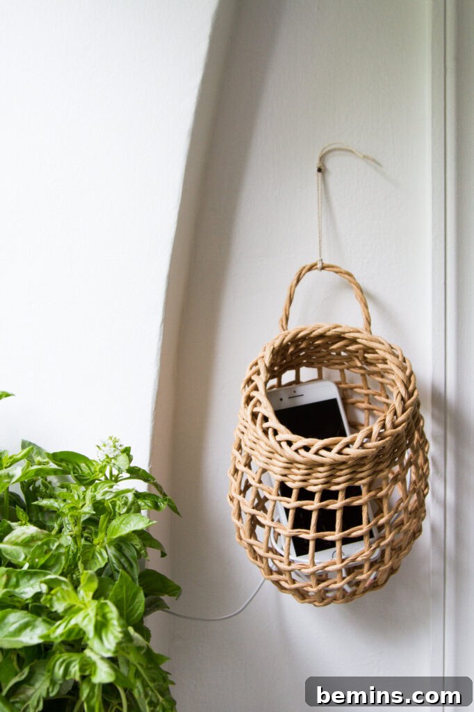 Effortless Home Oasis: Your Guide to a Summer Staycation 22 Wicker basket hanging on wall with cellphone inside