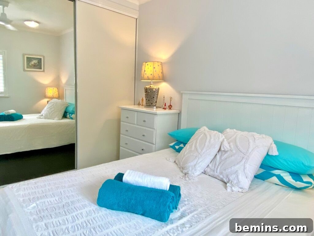 Effortless Home Oasis: Your Guide to a Summer Staycation 4 white wooden bed frame with white bed pillow
