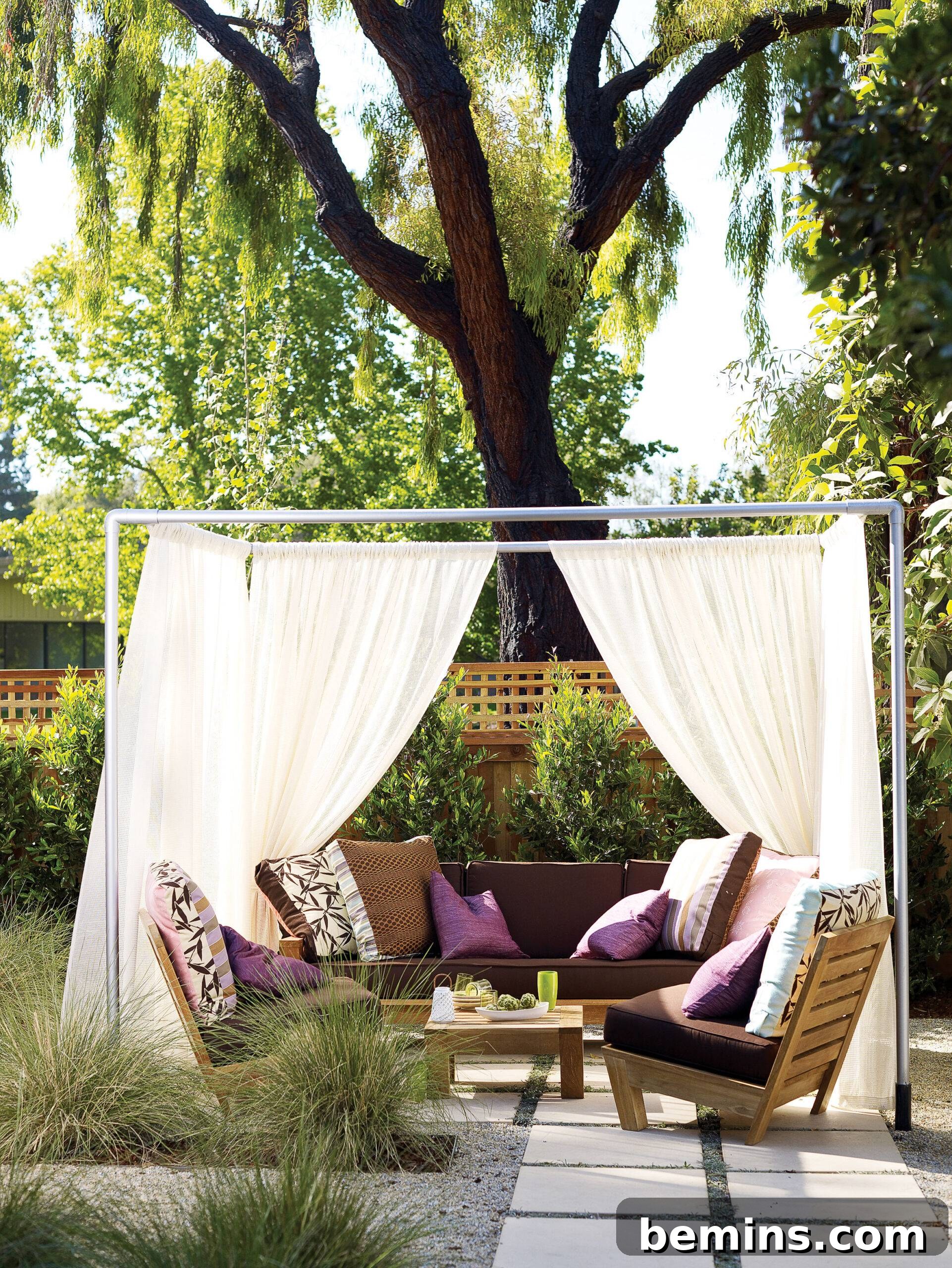 Effortless Home Oasis: Your Guide to a Summer Staycation 10 White cabana drapes around purple outdoor lounge chairs
