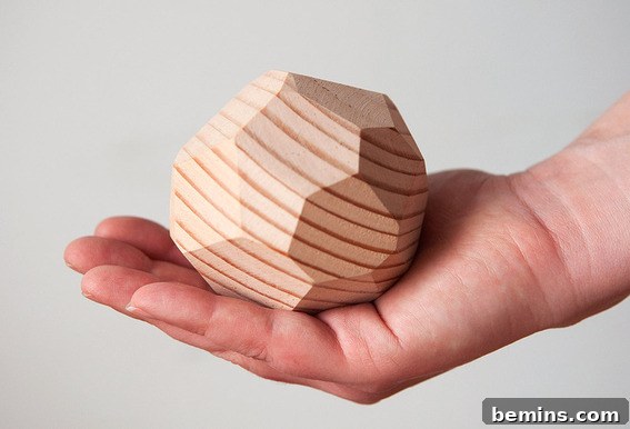 Modern Faceted Wood Paperweight on a Desk