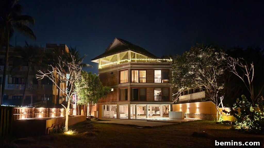 Transform Your Garden with Brilliant Uplighting Designs 3 Large building facade illuminated by multiple uplights