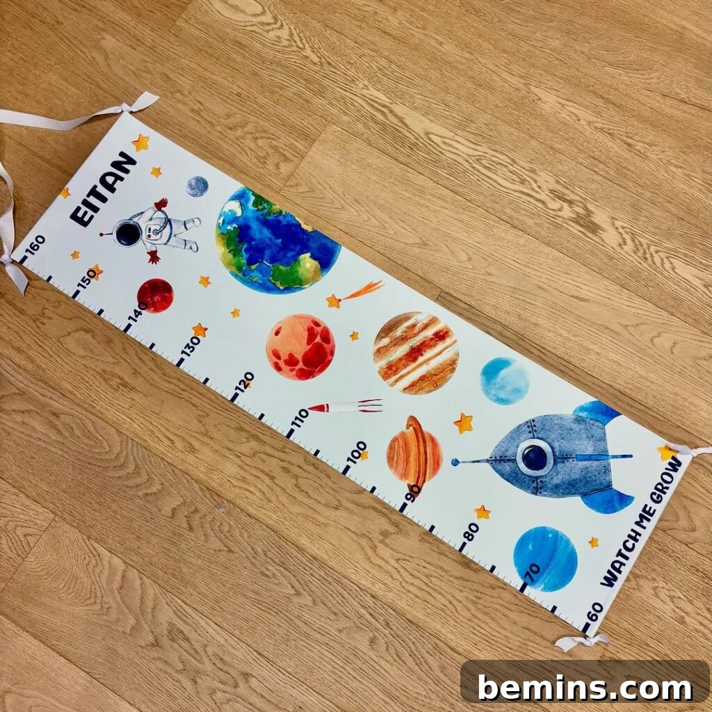 Launch Their Imagination: 20 Ultimate Space-Themed Kids Room Ideas 22 A white space-themed growth chart, designed to track a child's height with planetary markers, adding a fun and functional element to the room.