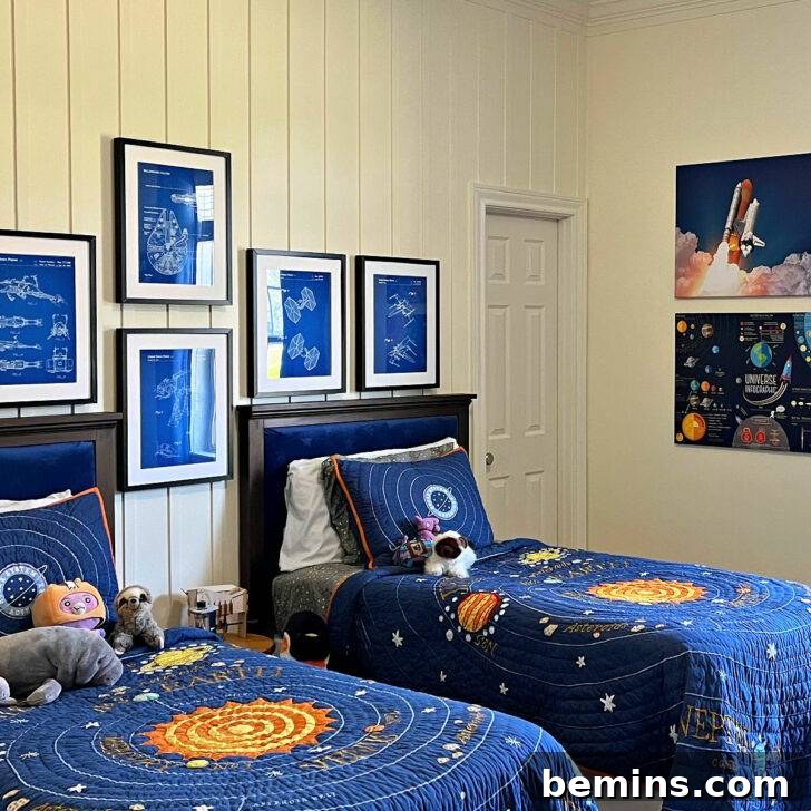 Launch Their Imagination: 20 Ultimate Space-Themed Kids Room Ideas 24 A cozy space-themed bedroom featuring planets on the bedding, creating a harmonious and inspiring cosmic retreat for a child.