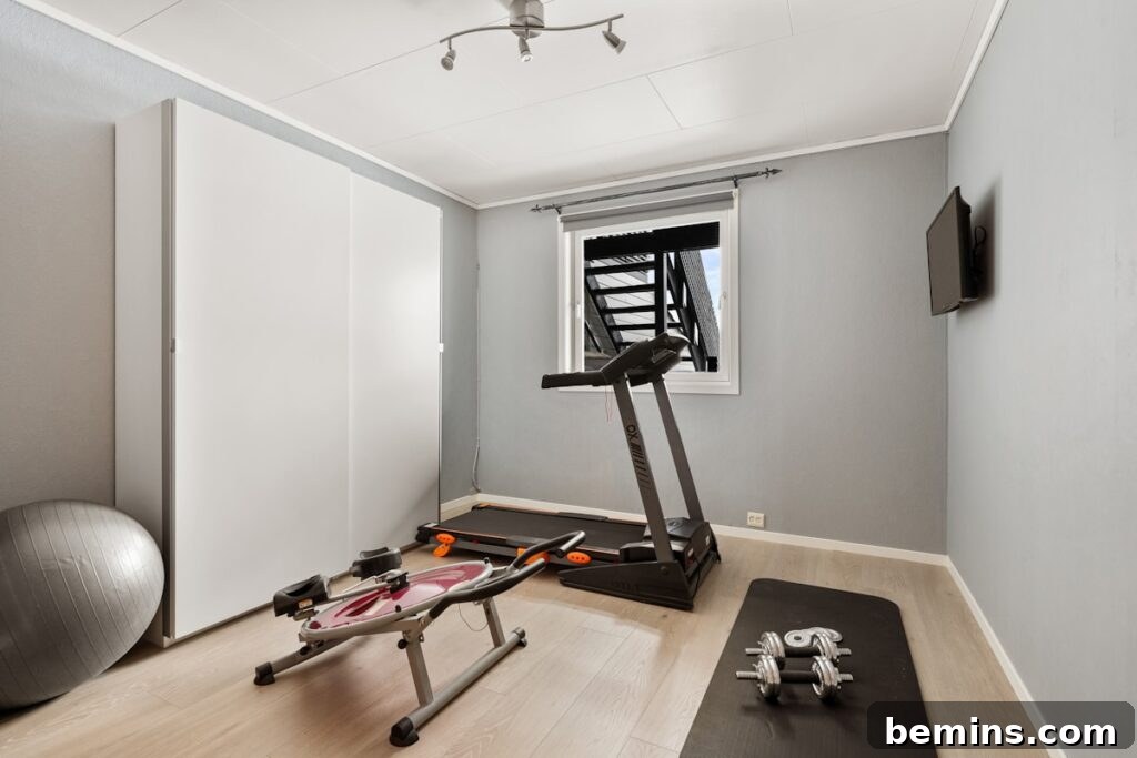 Maximizing Your Small Space: Smart Home Gym Design Ideas 3 A home gym with a treadmill and exercise equipment