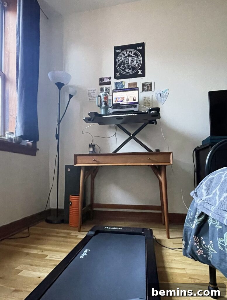 Maximizing Your Small Space: Smart Home Gym Design Ideas 8 Small walking pad set up next to home office desk