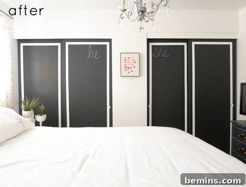 A room with a bed and closet with black doors